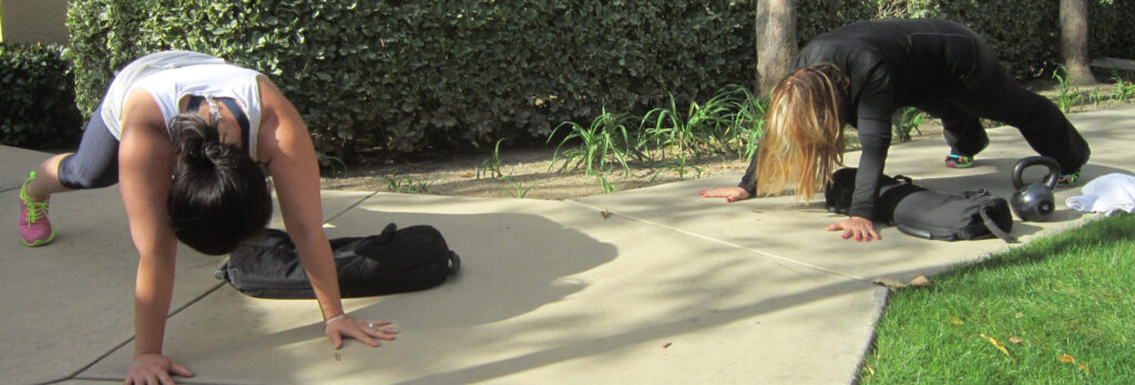 Sandbag workout for two women over 40