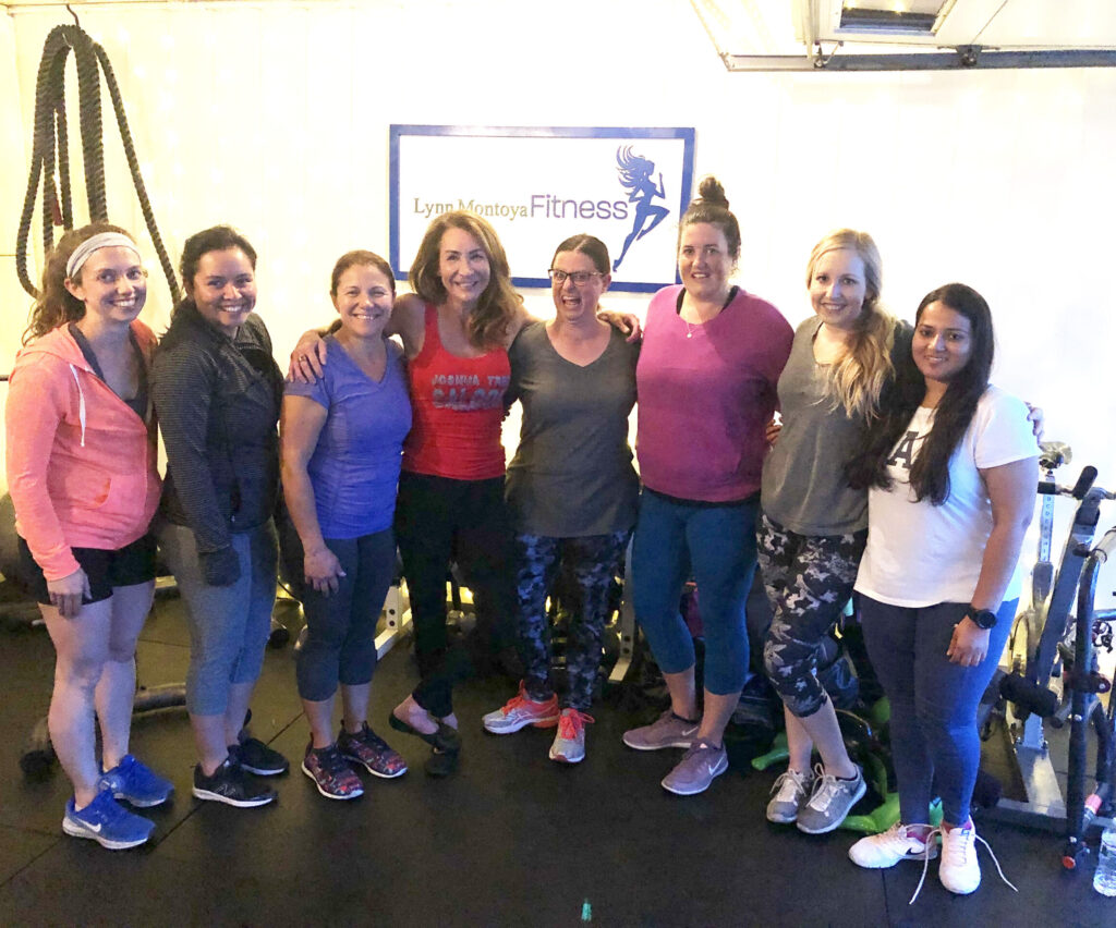 Group of women after completing a HIITCamp workout class at Lynn Montoya Fitness