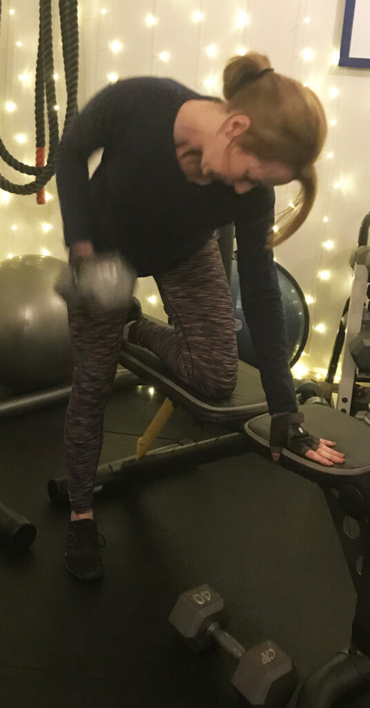 Woman over 40 performing a row